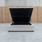 The Blake King Upholstered Gas Lift Storage Bed - Oat White available to purchase from Warehouse Furniture Clearance at our next sale event.