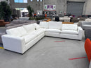 The HTL-12327-A Modular Corner Suite - Snow White - Floor Stock available to purchase from Warehouse Furniture Clearance at our next sale event.