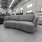 The COR-13033 2.5 seat curved sofa - Light Grey - Floor Stock available to purchase from Warehouse Furniture Clearance at our next sale event.