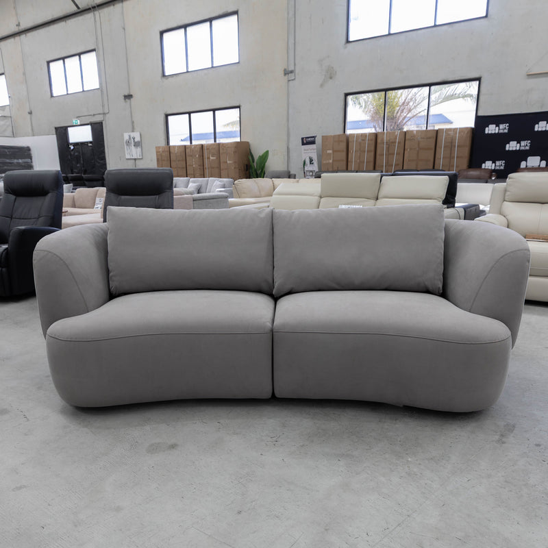 The COR-13033 2.5 seat curved sofa - Light Grey - Floor Stock available to purchase from Warehouse Furniture Clearance at our next sale event.