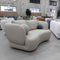 The COR-13033 2 seat leather curved sofa - Oatmeal - Floor Stock available to purchase from Warehouse Furniture Clearance at our next sale event.