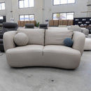The COR-13033 2 seat leather curved sofa - Oatmeal - Floor Stock available to purchase from Warehouse Furniture Clearance at our next sale event.
