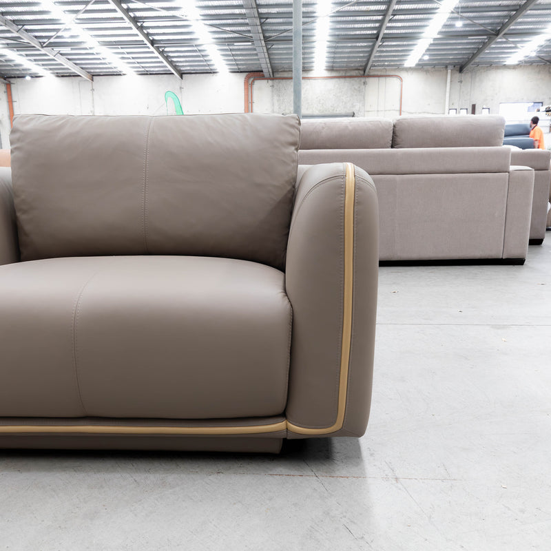 The COR-A0724 Oversized leather single chair - Pine Bark - Floor Stock available to purchase from Warehouse Furniture Clearance at our next sale event.