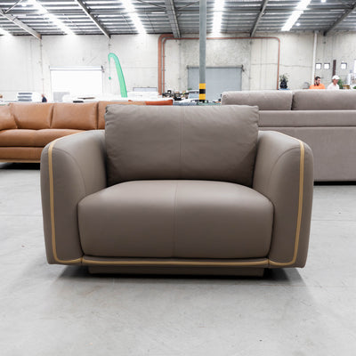 The COR-A0724 Oversized leather single chair - Pine Bark - Floor Stock available to purchase from Warehouse Furniture Clearance at our next sale event.