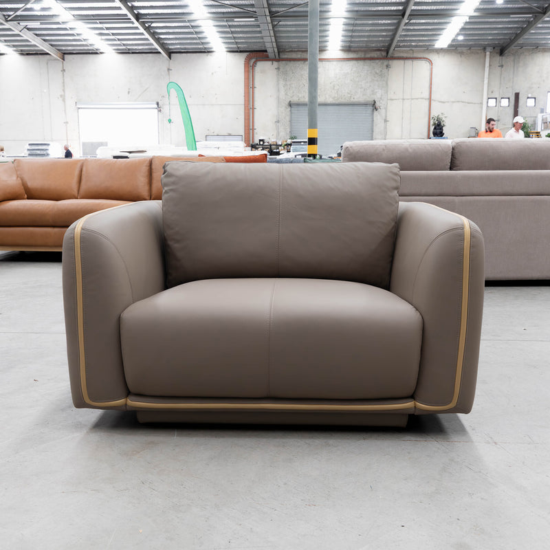 The COR-A0724 Oversized leather single chair - Pine Bark - Floor Stock available to purchase from Warehouse Furniture Clearance at our next sale event.