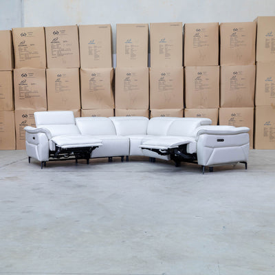 The Cali Electric Leather Corner Recliner Lounge - Bianco available to purchase from Warehouse Furniture Clearance at our next sale event.