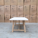 The Casper 230cm White Concrete Dining Table available to purchase from Warehouse Furniture Clearance at our next sale event.