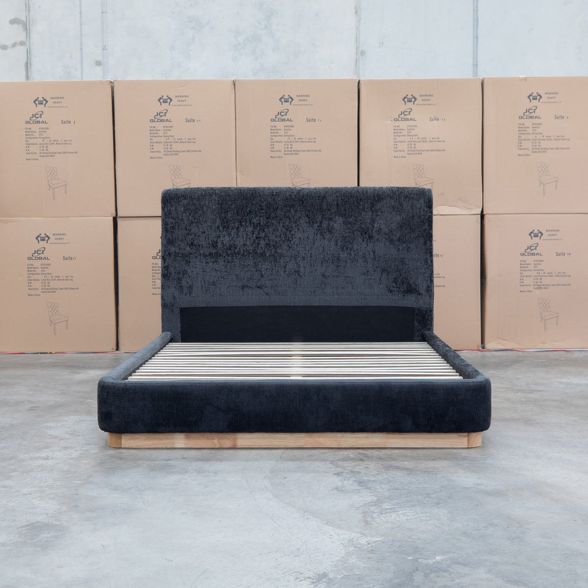 The Clara King Upholstered Bed with Solid Timber Plinth - Black available to purchase from Warehouse Furniture Clearance at our next sale event.