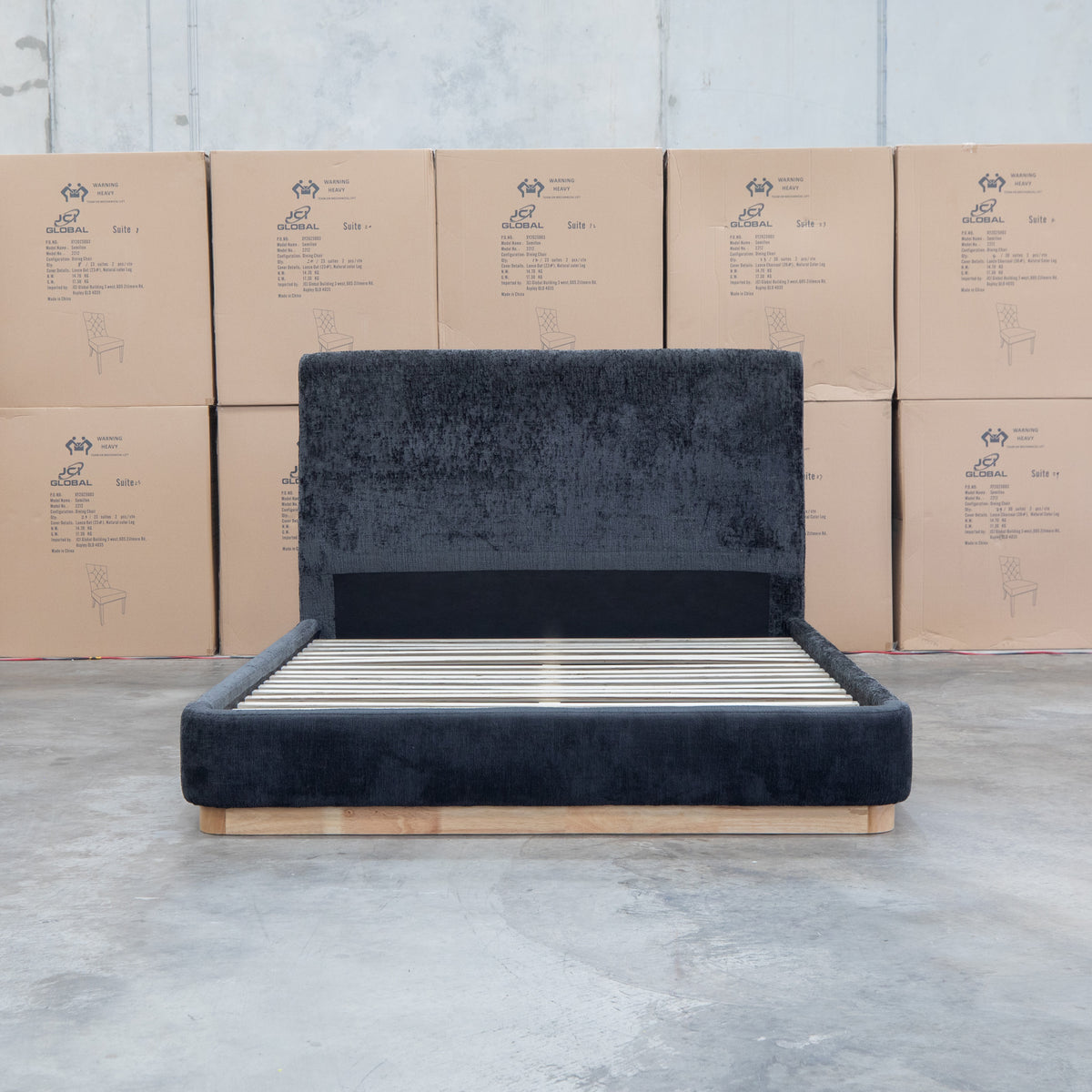 The Clara King Upholstered Bed with Solid Timber Plinth - Black available to purchase from Warehouse Furniture Clearance at our next sale event.