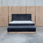 The Clara King Upholstered Bed with Solid Timber Plinth - Black available to purchase from Warehouse Furniture Clearance at our next sale event.
