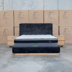 The Clara King Upholstered Bed with Solid Timber Plinth - Black available to purchase from Warehouse Furniture Clearance at our next sale event.