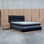 The Clara King Upholstered Bed with Solid Timber Plinth - Black available to purchase from Warehouse Furniture Clearance at our next sale event.