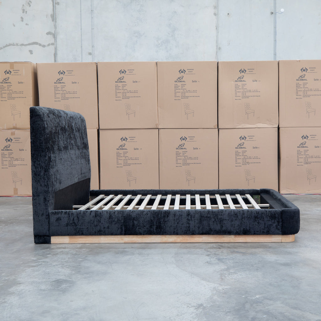 The Clara King Upholstered Bed with Solid Timber Plinth - Black available to purchase from Warehouse Furniture Clearance at our next sale event.