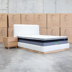 The Clara King Upholstered Bed with Solid Timber Plinth - Cream available to purchase from Warehouse Furniture Clearance at our next sale event.