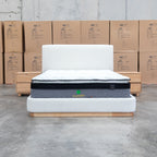 The Clara King Upholstered Bed with Solid Timber Plinth - Cream available to purchase from Warehouse Furniture Clearance at our next sale event.