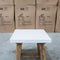The Cleo White Concrete & Acacia Timber Lamp Table available to purchase from Warehouse Furniture Clearance at our next sale event.