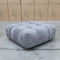 The Cloud Plush Fabric Ottoman - Slate available to purchase from Warehouse Furniture Clearance at our next sale event.