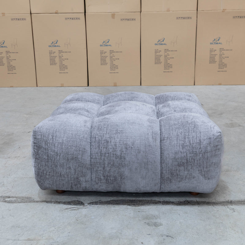 The Cloud Plush Fabric Ottoman - Slate available to purchase from Warehouse Furniture Clearance at our next sale event.