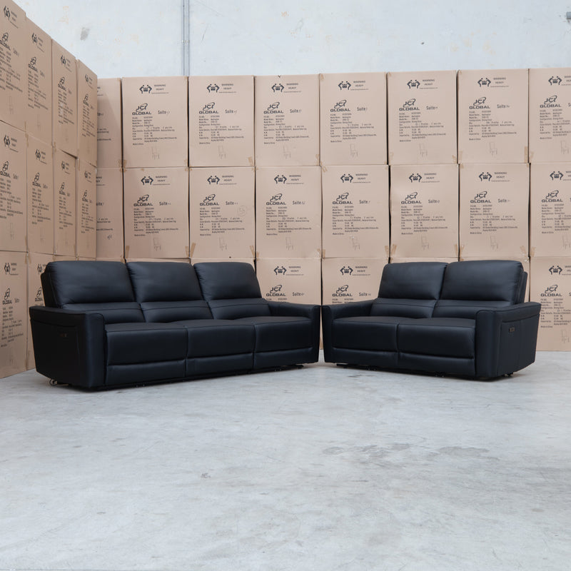 The Cobble Electric Two Seat Leather Recliner Lounge - Black available to purchase from Warehouse Furniture Clearance at our next sale event.