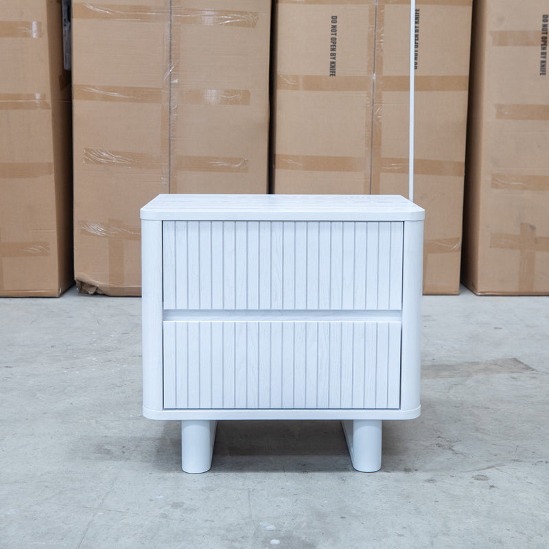 The Cooper Two Drawer White Ash Bedside - White available to purchase from Warehouse Furniture Clearance at our next sale event.