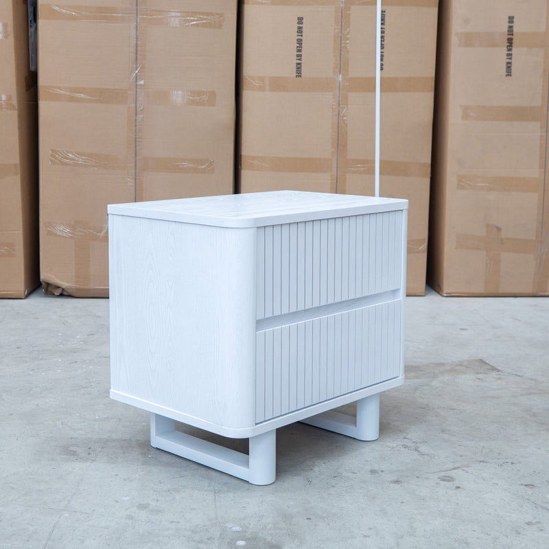 The Cooper Two Drawer White Ash Bedside - White available to purchase from Warehouse Furniture Clearance at our next sale event.