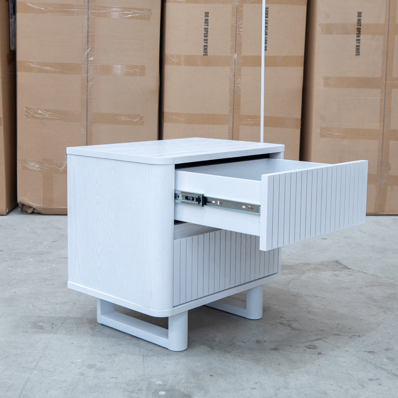 The Cooper Two Drawer White Ash Bedside - White available to purchase from Warehouse Furniture Clearance at our next sale event.