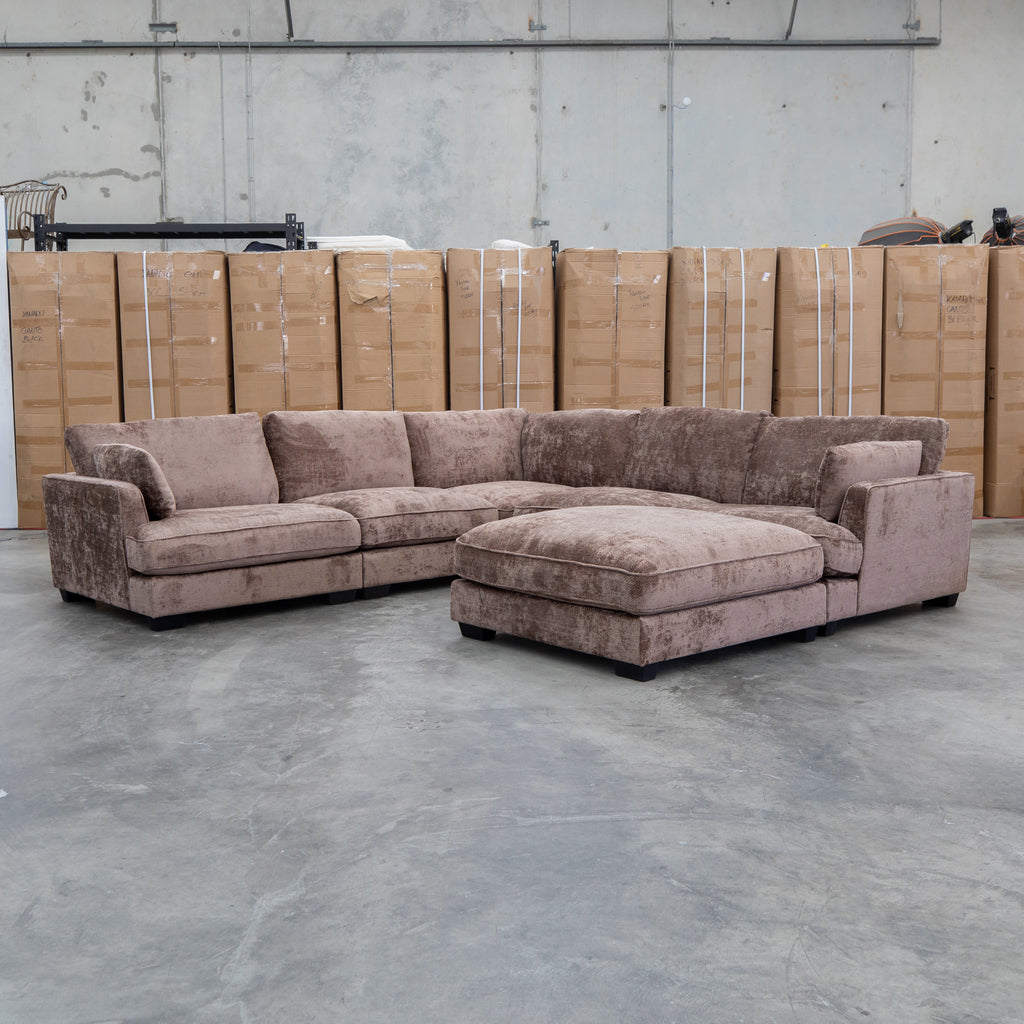 The Veloura Feather & Foam Corner Suite with Ottoman - Fiona Chocolate available to purchase from Warehouse Furniture Clearance at our next sale event.