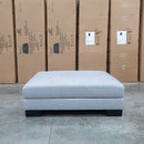 The Delta Oversized Ottoman - Silver available to purchase from Warehouse Furniture Clearance at our next sale event.