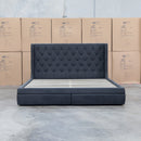 The Denmark Queen Fabric Storage Bed - Charcoal available to purchase from Warehouse Furniture Clearance at our next sale event.
