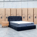 The Elm Double Upholstered Bed - Black available to purchase from Warehouse Furniture Clearance at our next sale event.