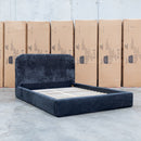 The Elm Double Upholstered Bed - Black available to purchase from Warehouse Furniture Clearance at our next sale event.