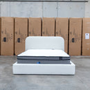 The Elm Double Upholstered Bed - Cream available to purchase from Warehouse Furniture Clearance at our next sale event.
