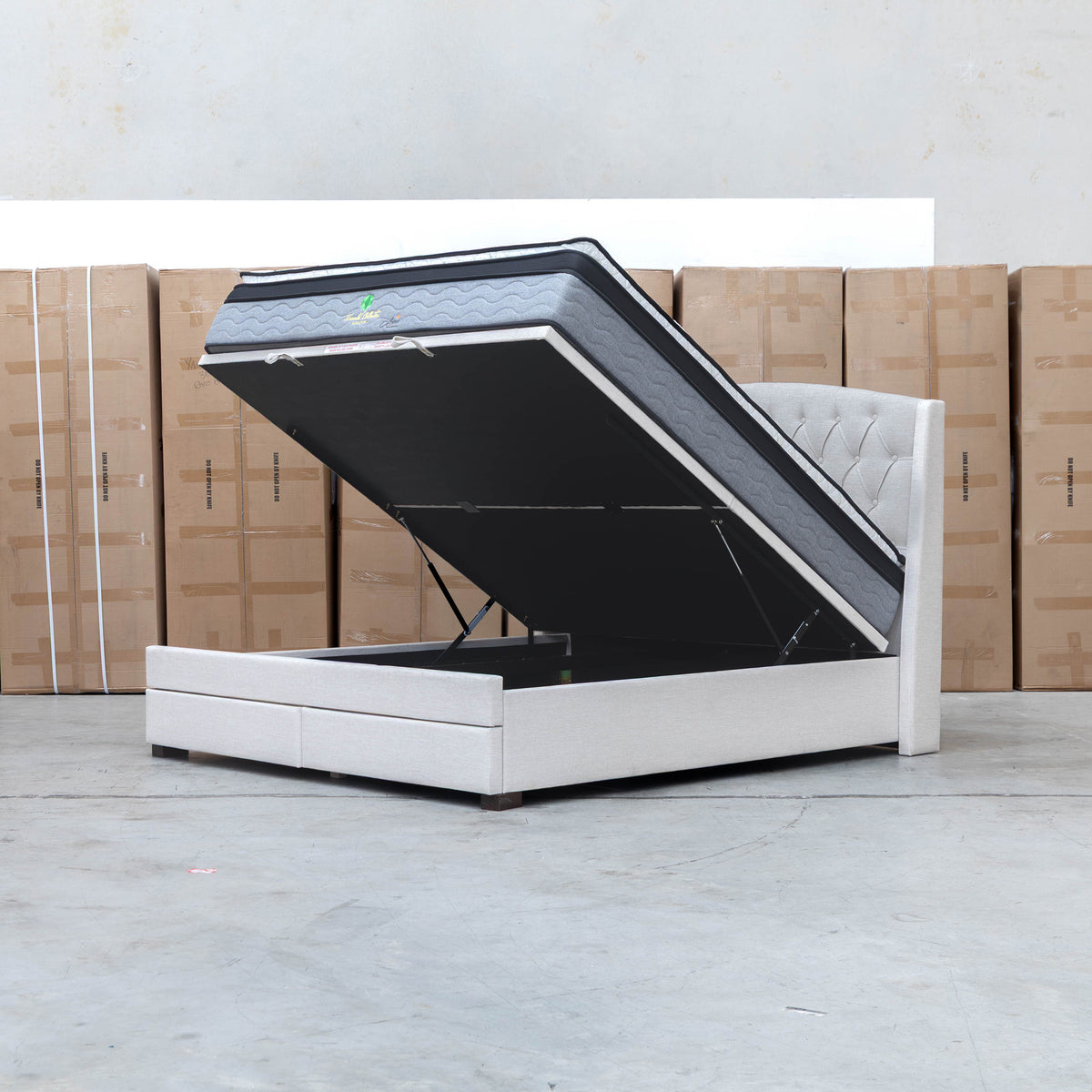 The Emily King Fabric Gas Lift Storage Drawer Bed - Oat White available to purchase from Warehouse Furniture Clearance at our next sale event.