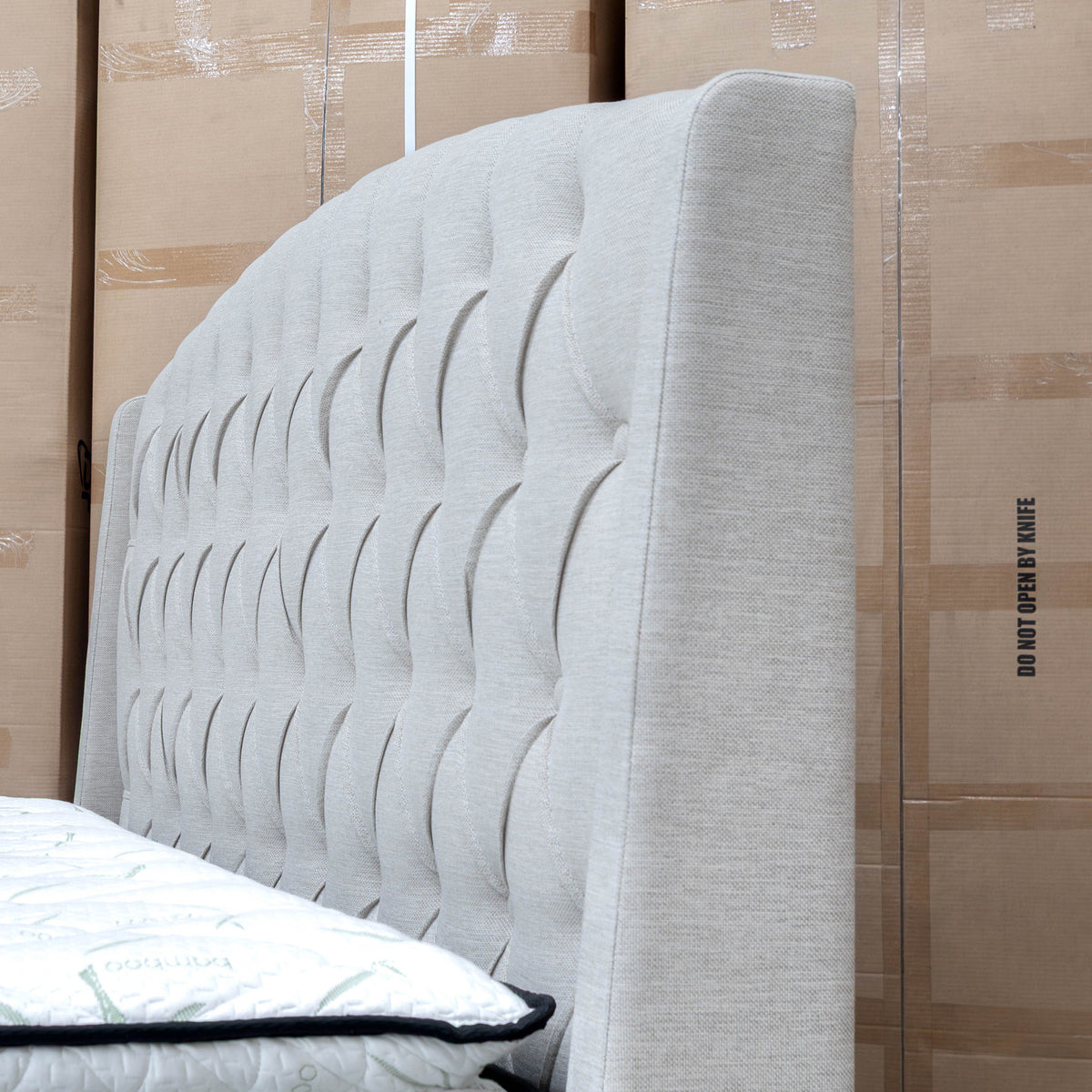 The Emily King Fabric Gas Lift Storage Drawer Bed - Oat White available to purchase from Warehouse Furniture Clearance at our next sale event.