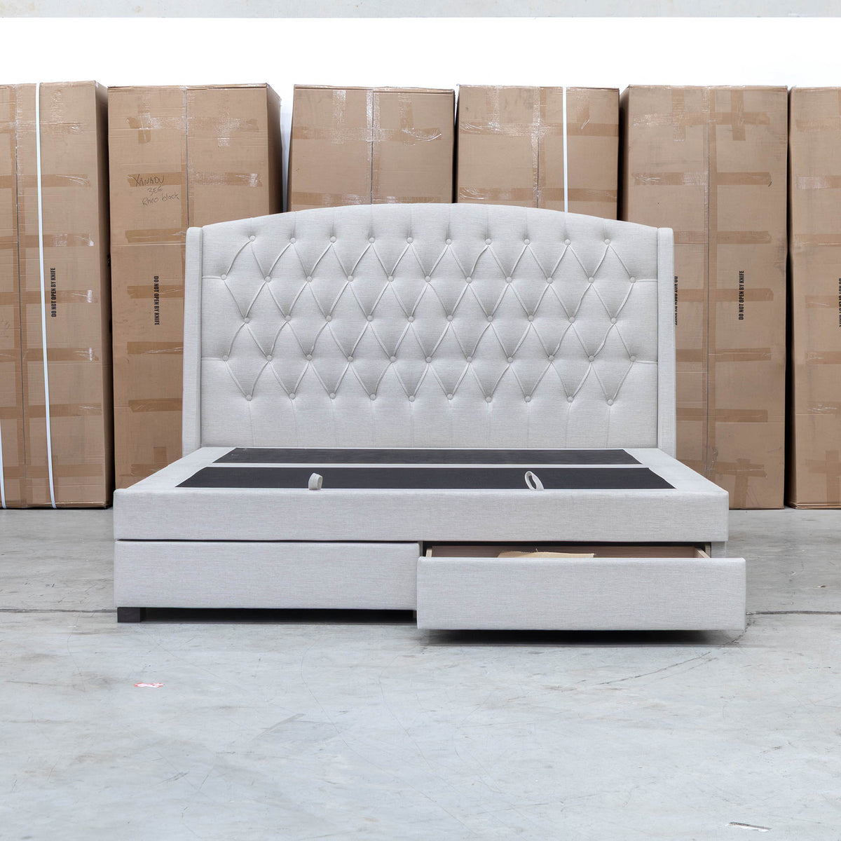 The Emily Double Fabric Gas Lift Storage Drawer Bed - Oat White available to purchase from Warehouse Furniture Clearance at our next sale event.