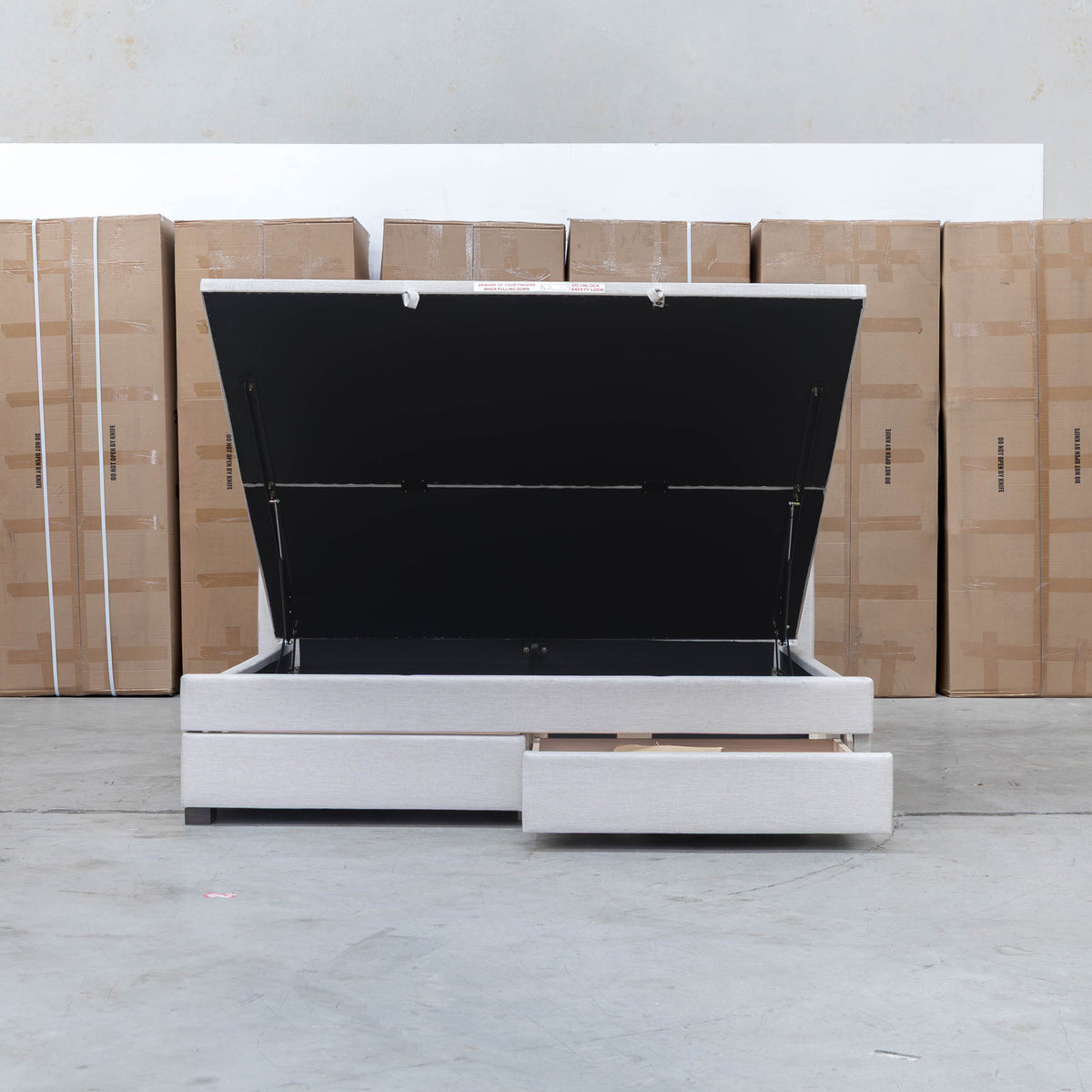 The Emily Double Fabric Gas Lift Storage Drawer Bed - Oat White available to purchase from Warehouse Furniture Clearance at our next sale event.
