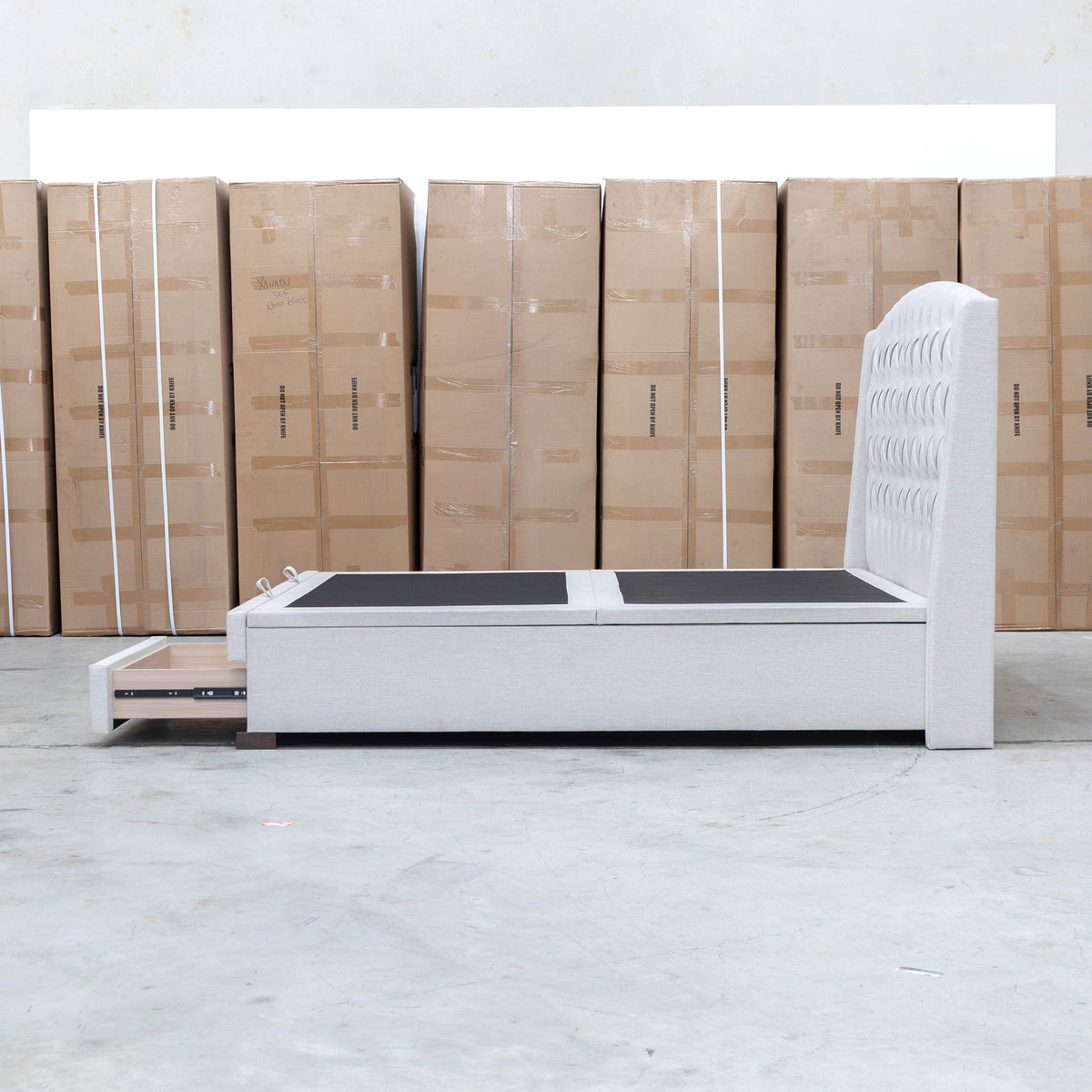 The Emily Double Fabric Gas Lift Storage Drawer Bed - Oat White available to purchase from Warehouse Furniture Clearance at our next sale event.