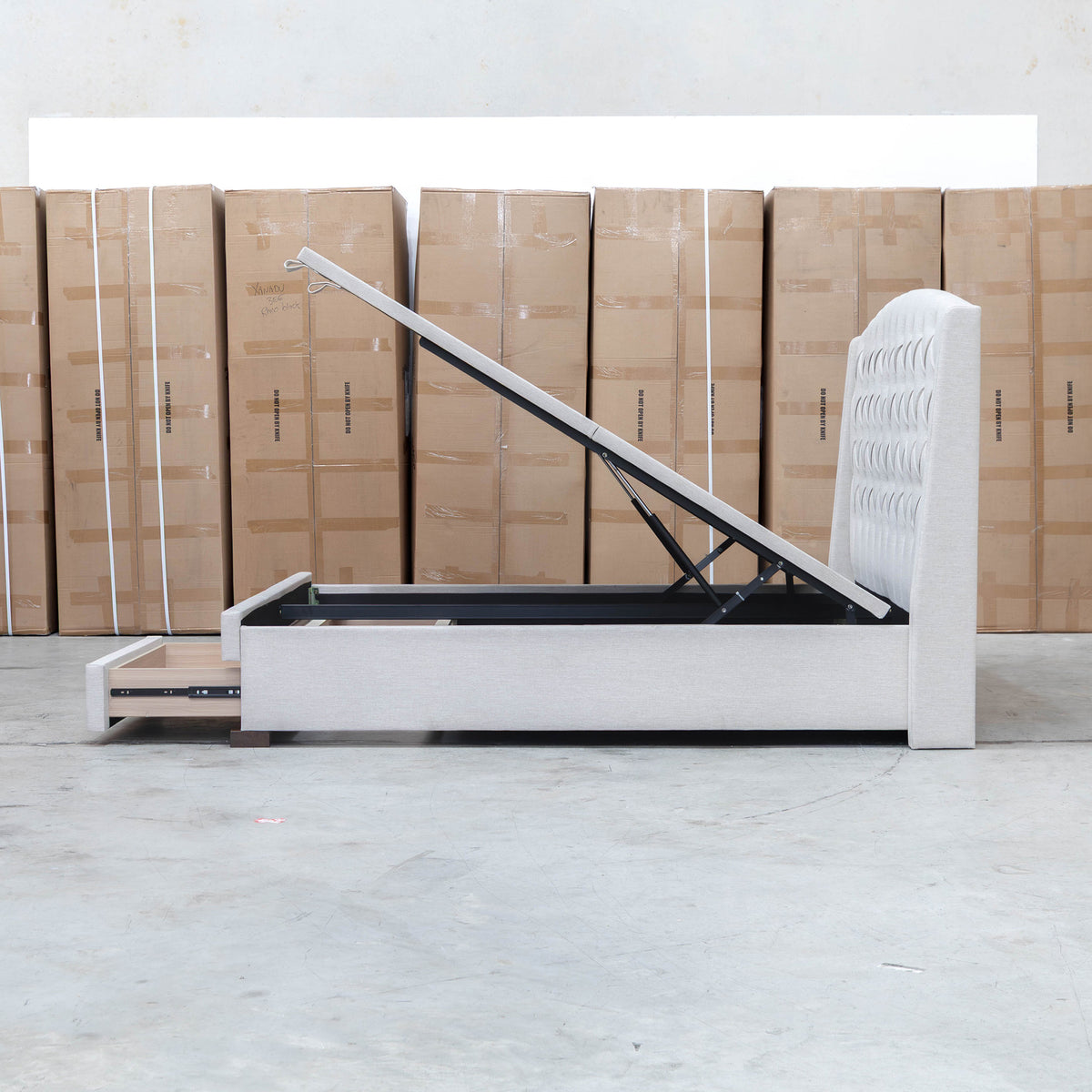 The Emily Double Fabric Gas Lift Storage Drawer Bed - Oat White available to purchase from Warehouse Furniture Clearance at our next sale event.