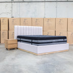 The Esperance King Fabric Gas Lift Storage Bed - Beige available to purchase from Warehouse Furniture Clearance at our next sale event.