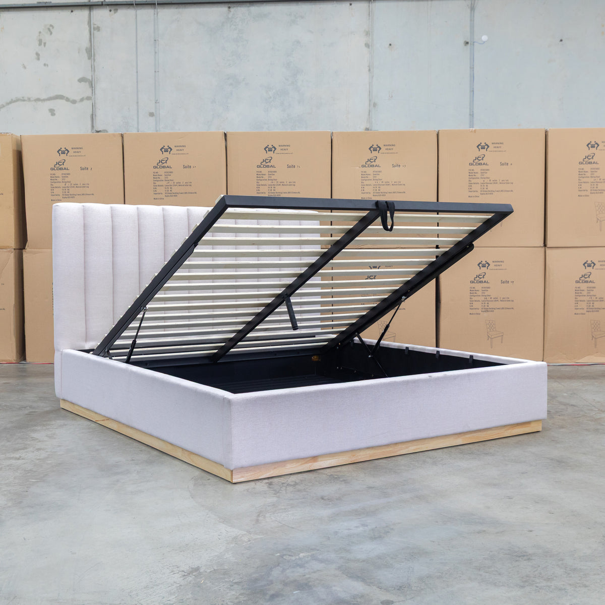 The Esperance King Fabric Gas Lift Storage Bed - Beige available to purchase from Warehouse Furniture Clearance at our next sale event.