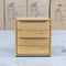 The Newfarm Distressed Oak Two Drawer Hardwood Bedside available to purchase from Warehouse Furniture Clearance at our next sale event.