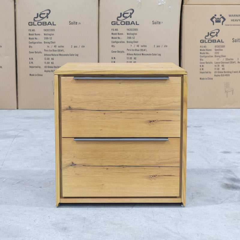 The Newfarm Distressed Oak Two Drawer Hardwood Bedside available to purchase from Warehouse Furniture Clearance at our next sale event.