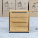 The Newfarm Distressed Oak Two Drawer Hardwood Bedside available to purchase from Warehouse Furniture Clearance at our next sale event.