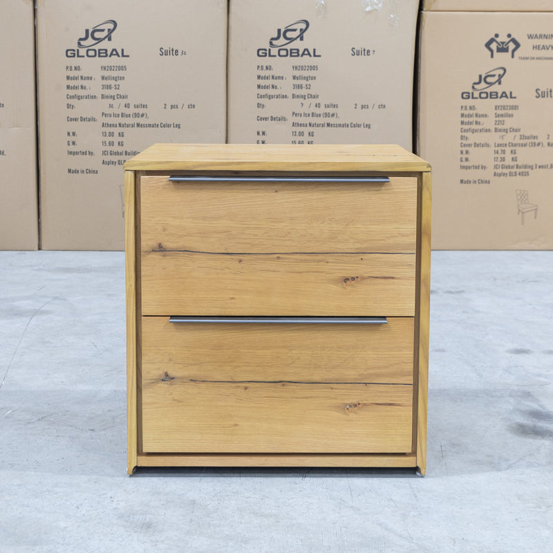 The Newfarm Distressed Oak Two Drawer Hardwood Bedside available to purchase from Warehouse Furniture Clearance at our next sale event.