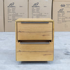The Newfarm Distressed Oak Two Drawer Hardwood Bedside available to purchase from Warehouse Furniture Clearance at our next sale event.