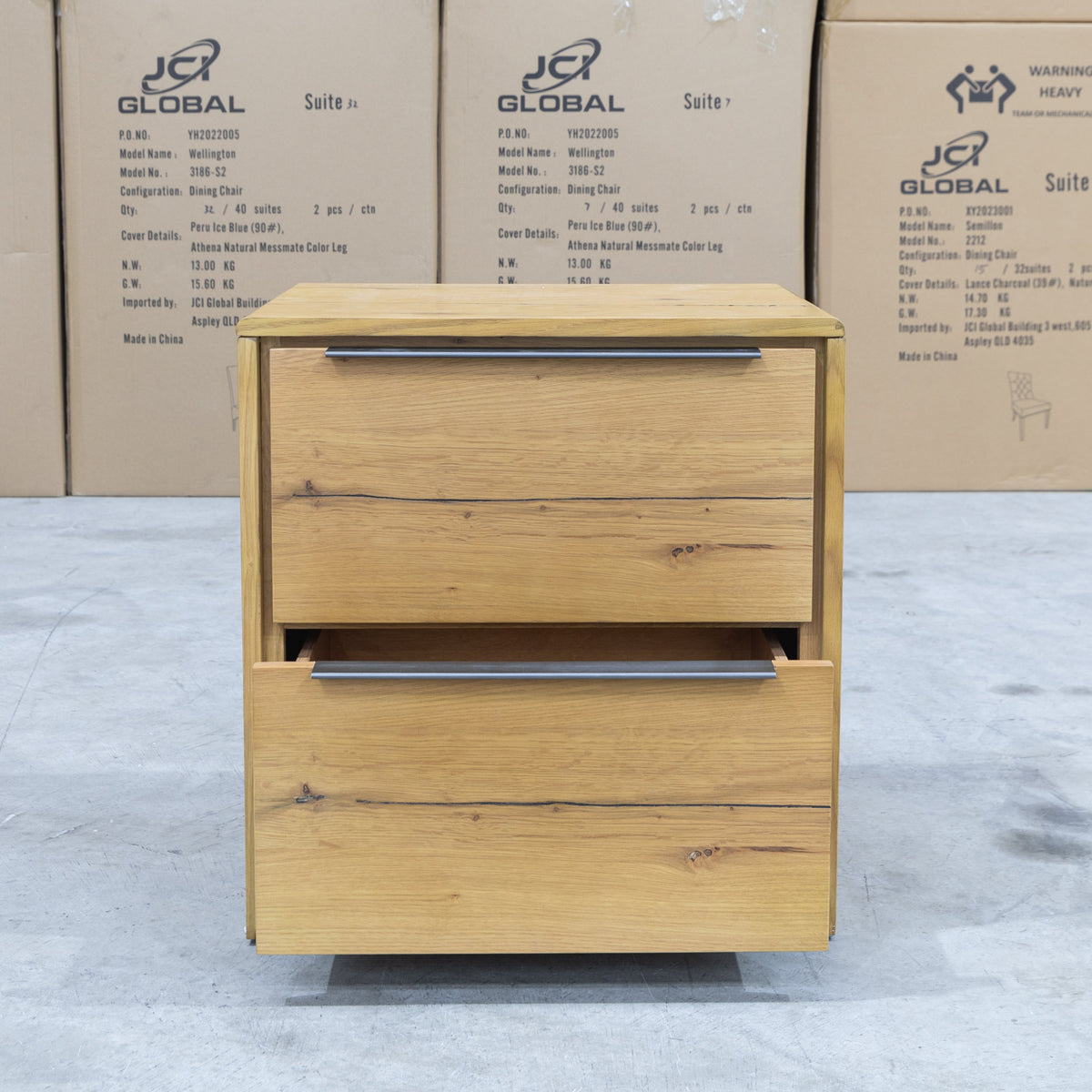 The Newfarm Distressed Oak Two Drawer Hardwood Bedside available to purchase from Warehouse Furniture Clearance at our next sale event.