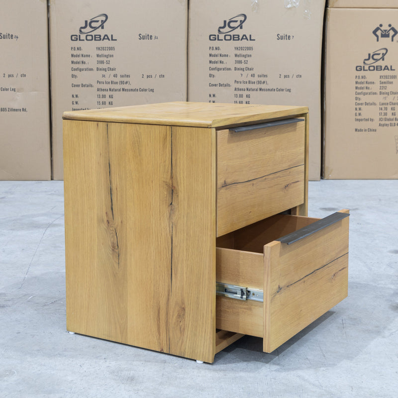The Newfarm Distressed Oak Two Drawer Hardwood Bedside available to purchase from Warehouse Furniture Clearance at our next sale event.