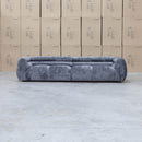 The Fara Curved Fabric Four Seat Sofa - Steel available to purchase from Warehouse Furniture Clearance at our next sale event.