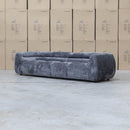 The Fara Curved Fabric Four Seat Sofa - Steel available to purchase from Warehouse Furniture Clearance at our next sale event.