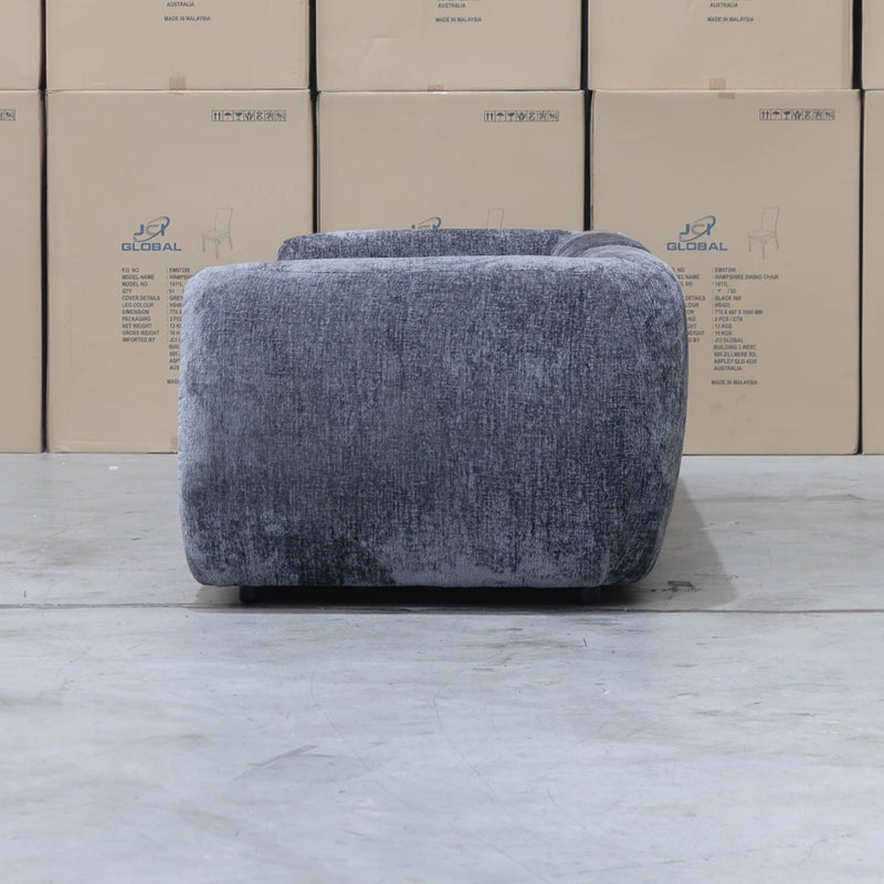 The Fara Curved Fabric Four Seat Sofa - Steel available to purchase from Warehouse Furniture Clearance at our next sale event.